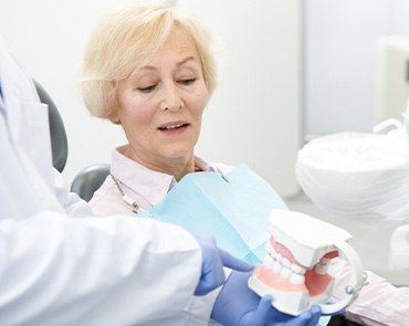 Dentist in Ponte Vedra Beach talking to patient about missing teeth 