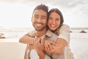 Man and woman smiling on beach